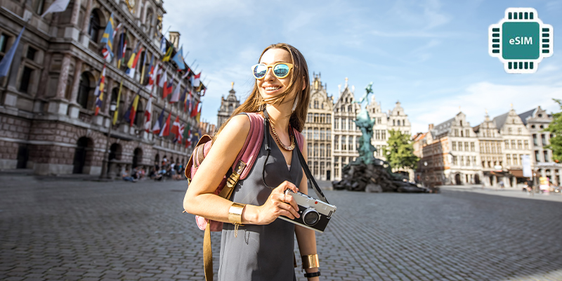 a women with bagpack and camera in hand