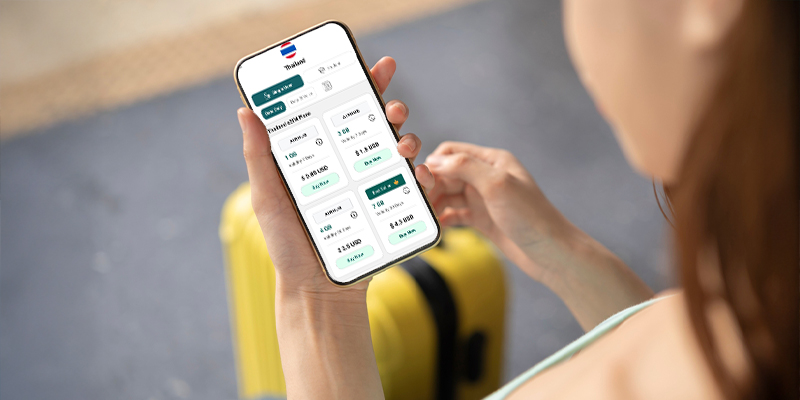 a women using Airhub's Thailand eSIM plans on mobile phone
