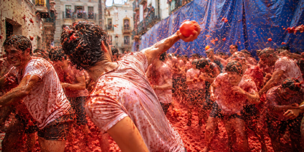 people celebrating La Tomatina festival