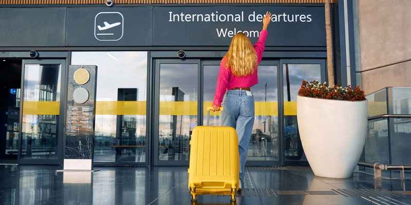 a women with luggage at the airport