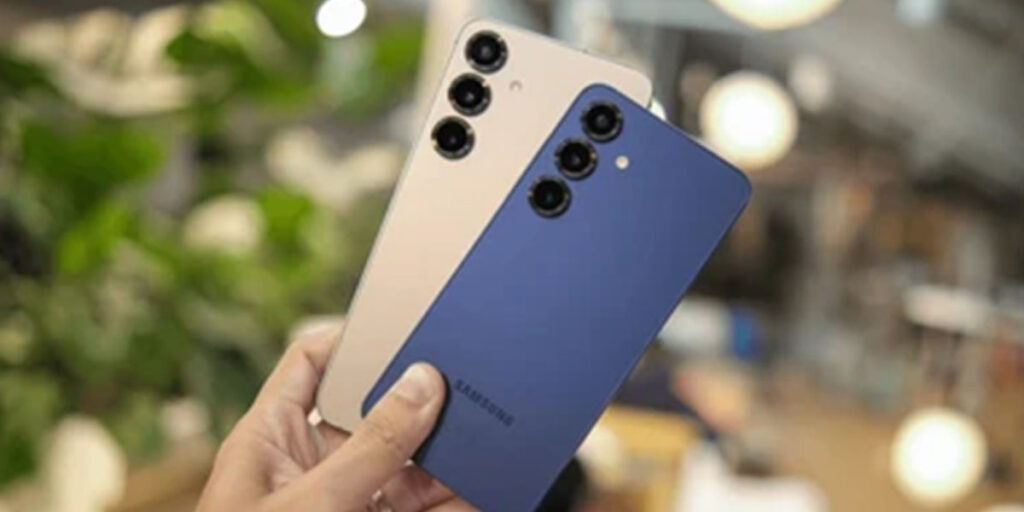 holding two Samsung mobile phones