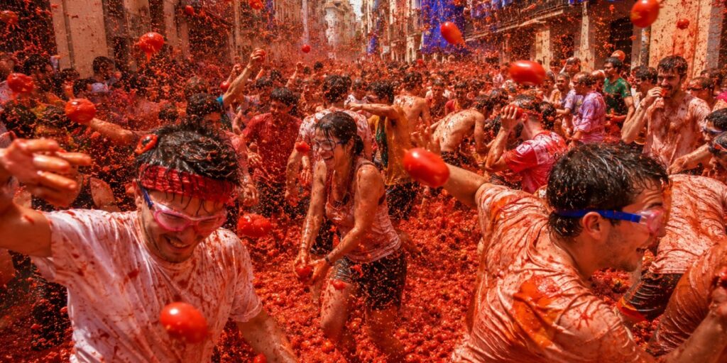 La Tomatina Spain festival with famous tomato food fight crowds